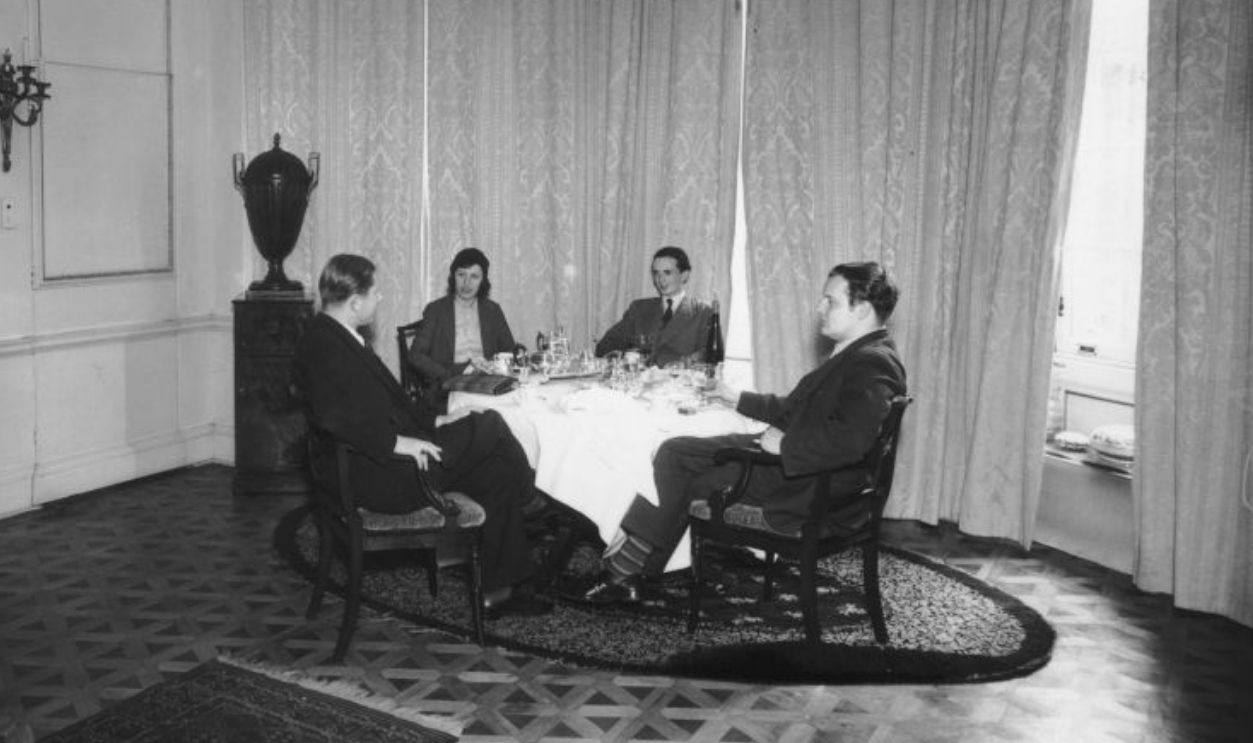 Actress and dancer Tilly Losch having drinks at home with her art collector husband Edward James, second from right, and composer Constant Lambert, right, 1933. The house is in Monkton near West Dean, South East England.
