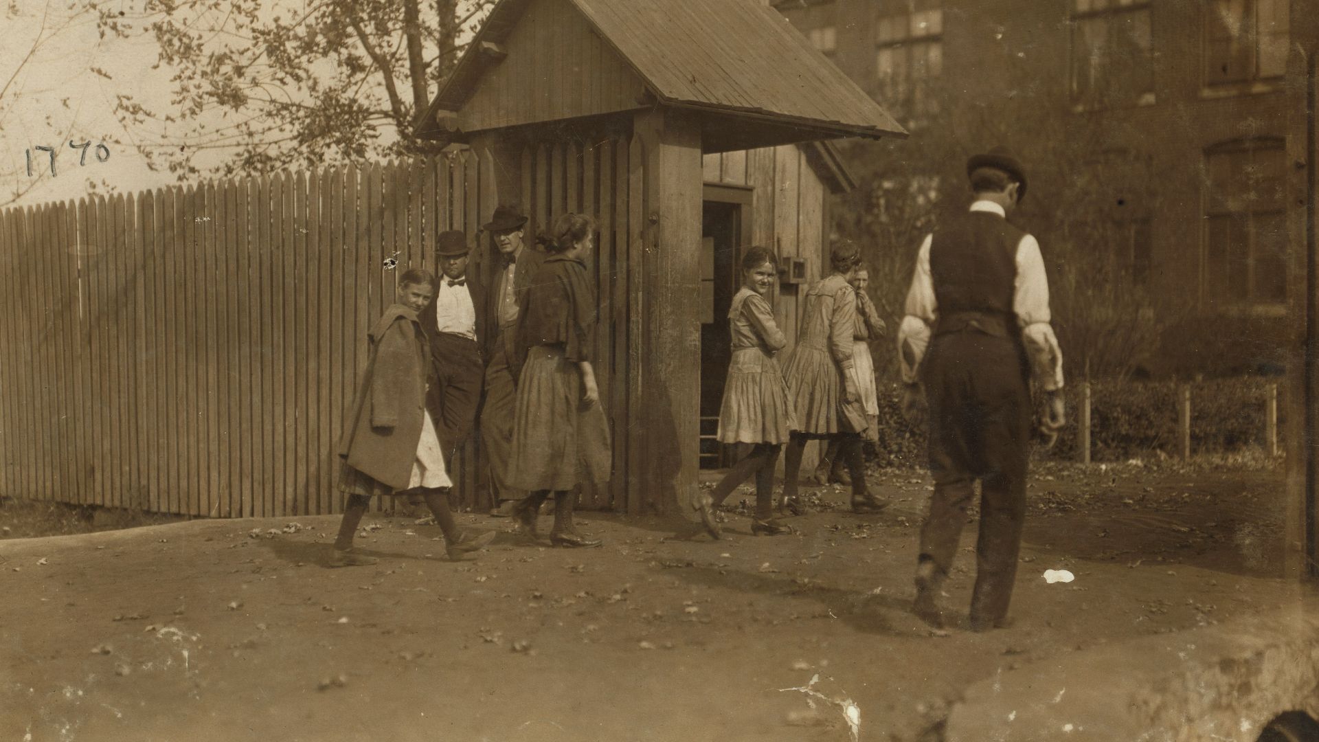 Title: Young girls going to work noon-hour Merrimac Mills.
Abstract: Photographs from the records of the National Child Labor Committee (U.S.)
Physical description: 1 photographic print.

Notes: Girls.; Men.; Textile mill workers.; Rest periods.