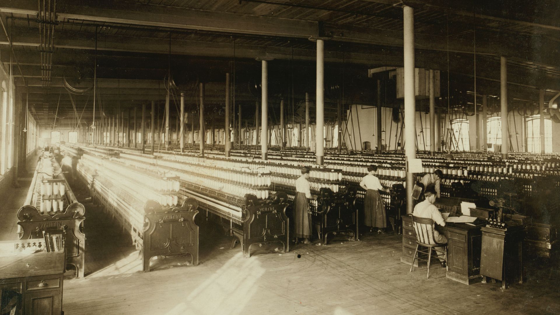 Title: For Child Welfare Exhibit 1912-13.) View in Lonsdale R.I. Mills
Abstract: Photographs from the records of the National Child Labor Committee (U.S.)
Physical description: 1 photographic print.

Notes: Women.; Textile mill workers.; Textile machinery