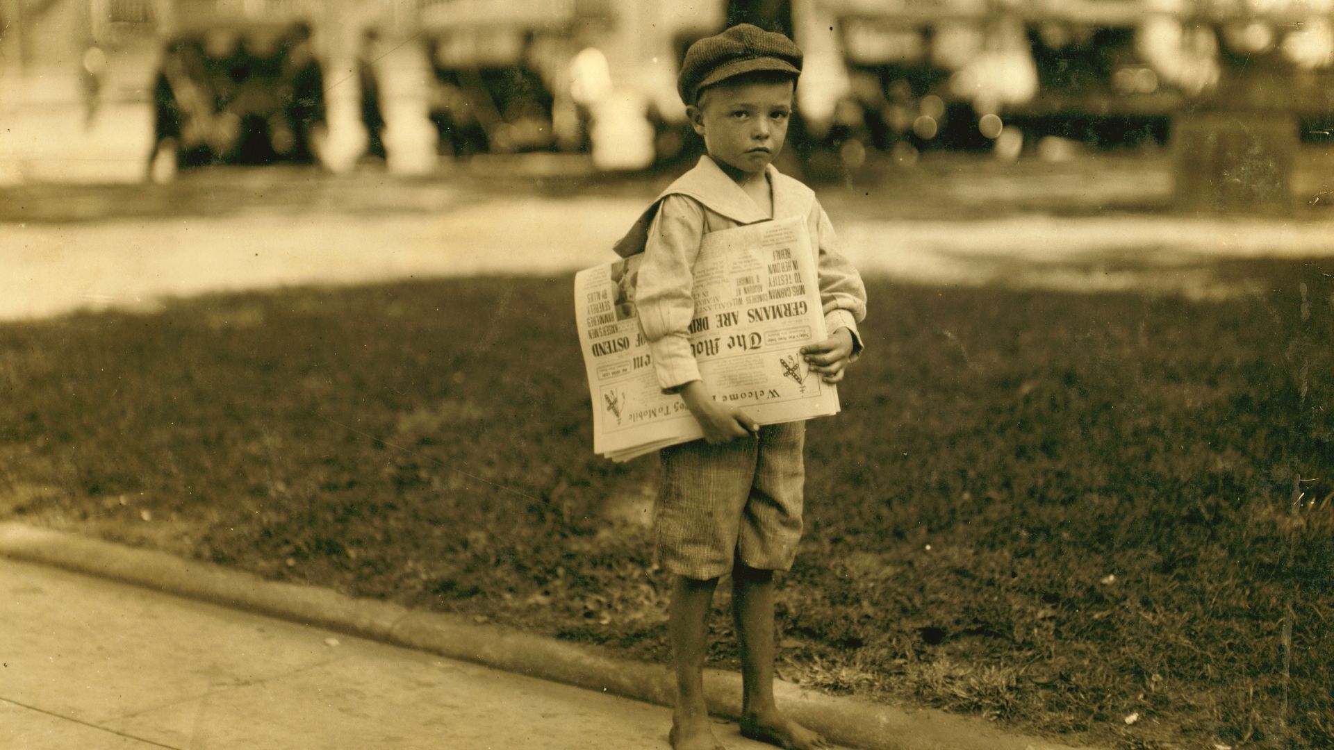 7 year old Ferris. Tiny newsie who did not know enough to make change for investigator. There are still too many of these little ones in the larger cities. Location: Mobile, Alabama. Photograph by Lewis Wickes Hine, October 1914.

From the National Child 