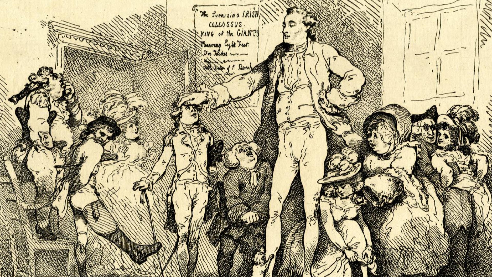 The giant, good-looking and slim, his legs disproportionately long, stands in a room surrounded by admiring spectators. He rests his right hand on the head of a foppish young man in regimentals. An elderly officer (left) stands on a chair inspecting him t