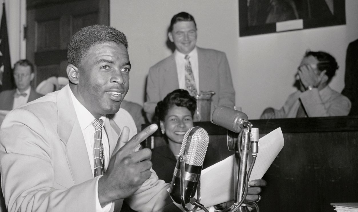 Jackie Robinson, ace second baseman for the Brooklyn Dodgers, told the House Unamerican Activities Committee today that singer Paul Robeson was 