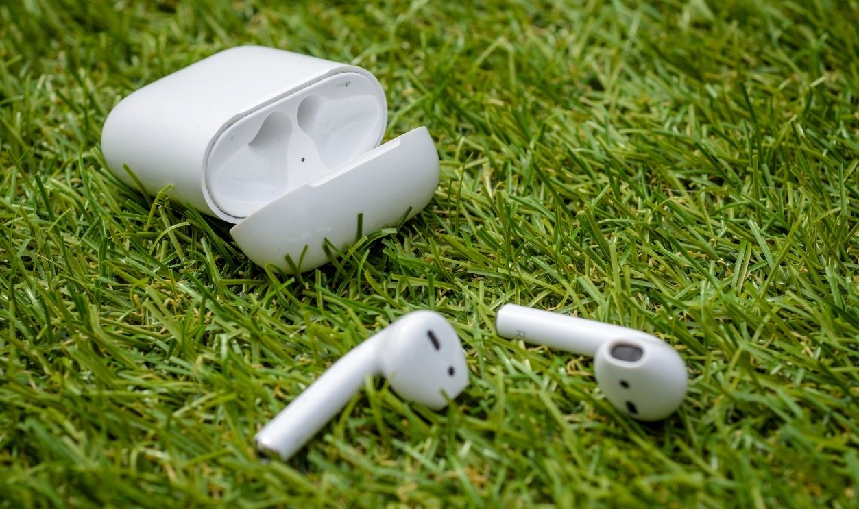 London, England - April 27, 2020: Apple AirPods and Charging Case, Apple AirPods Wireless Headphones were first introduced in 2016