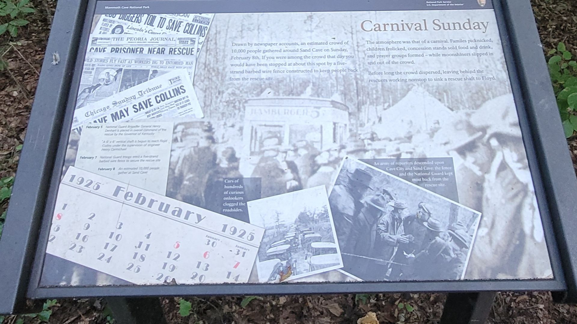 NPS marker for Carnival Sunday and the barbed wire barrier constructed to keep people back from Sand Cave during the attempted rescue of Floyd Collins.