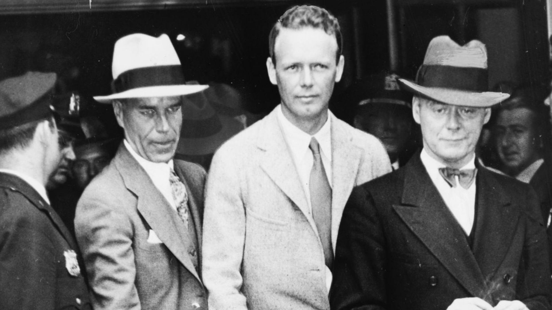 Charles A. Lindbergh after telling the grand jury his story of the payment of $50,000 ransom for his son. At the right is Colonel H. Norman Schwarzkopf, of the New Jersey State Police, who accompanied Colonel Lindbergh.

Original title: After Lindbergh to