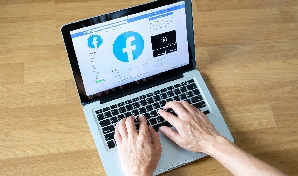 March 5, 2019 Bangkok, Thailand young men use computer laptop internet looking screen Facebook is social networking service.he surf the Internet to get information of the world.