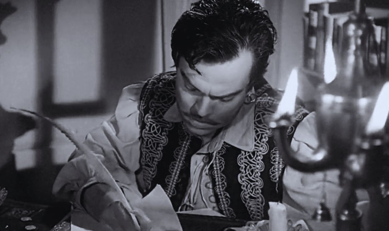 Screenshot from Black Magic (1949)