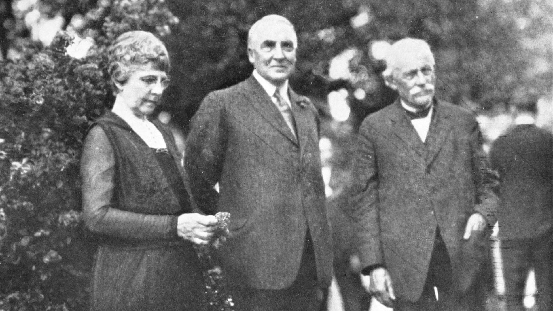 President Warren G. Harding with his wife and father