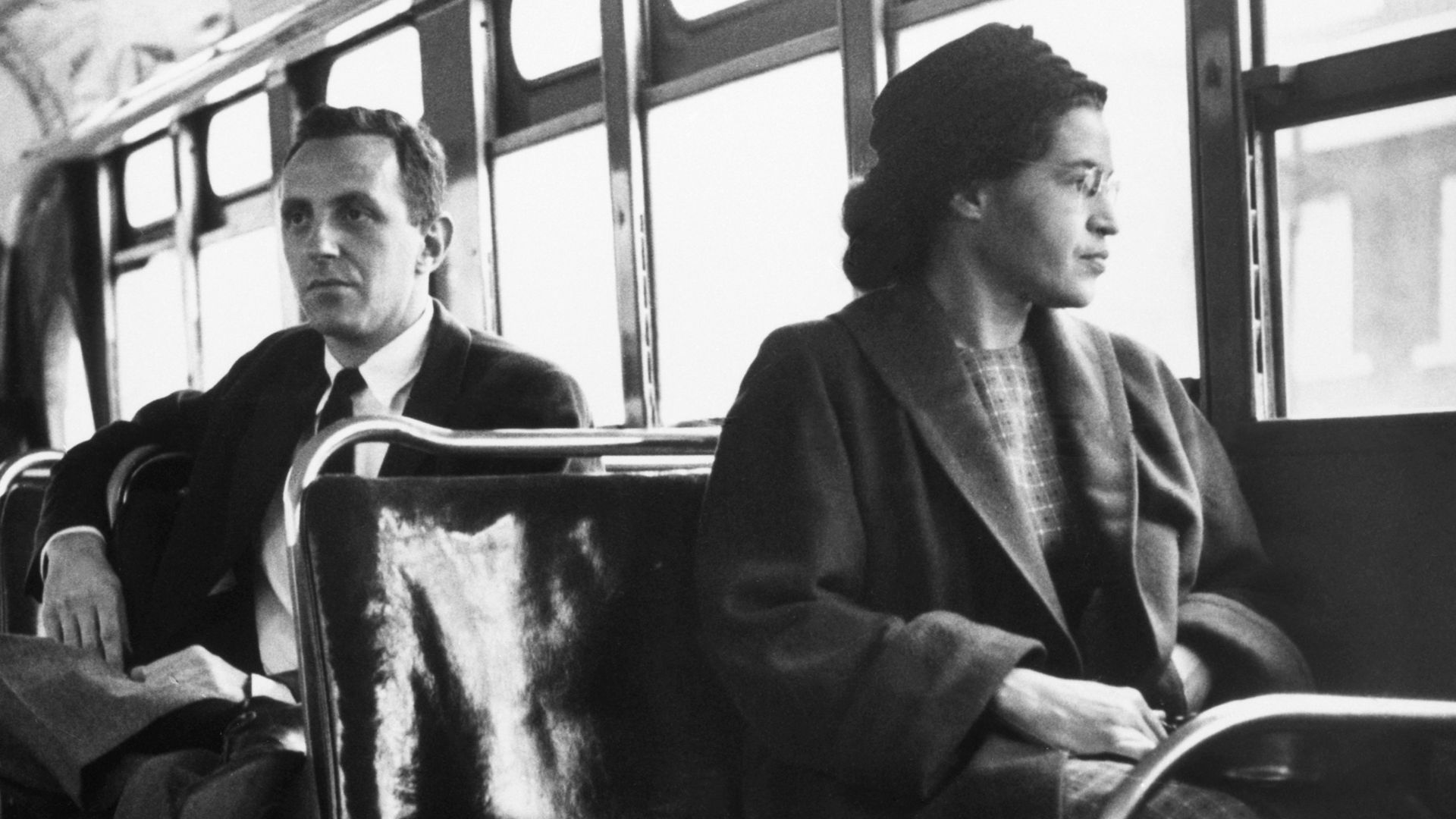 Rosa Parks sits in the front of a bus in Montgomery, Alabama, in 1956 after the U.S. Supreme Court ruled segregation illegal on the city's bus system. Behind Parks is Nicholas C. Chriss, a UPI reporter covering the event.


Original caption by United Pres