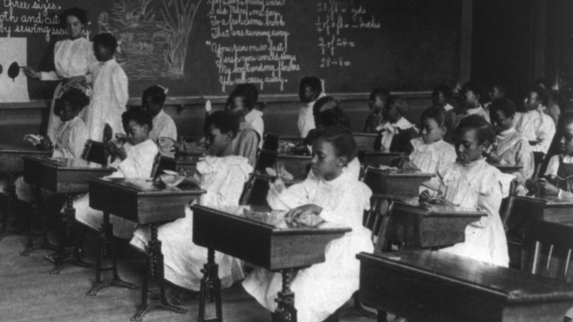 Title: African American schoolgirls in classroom, learning to sew
Abstract/medium: 1 photographic print : cyanotype.