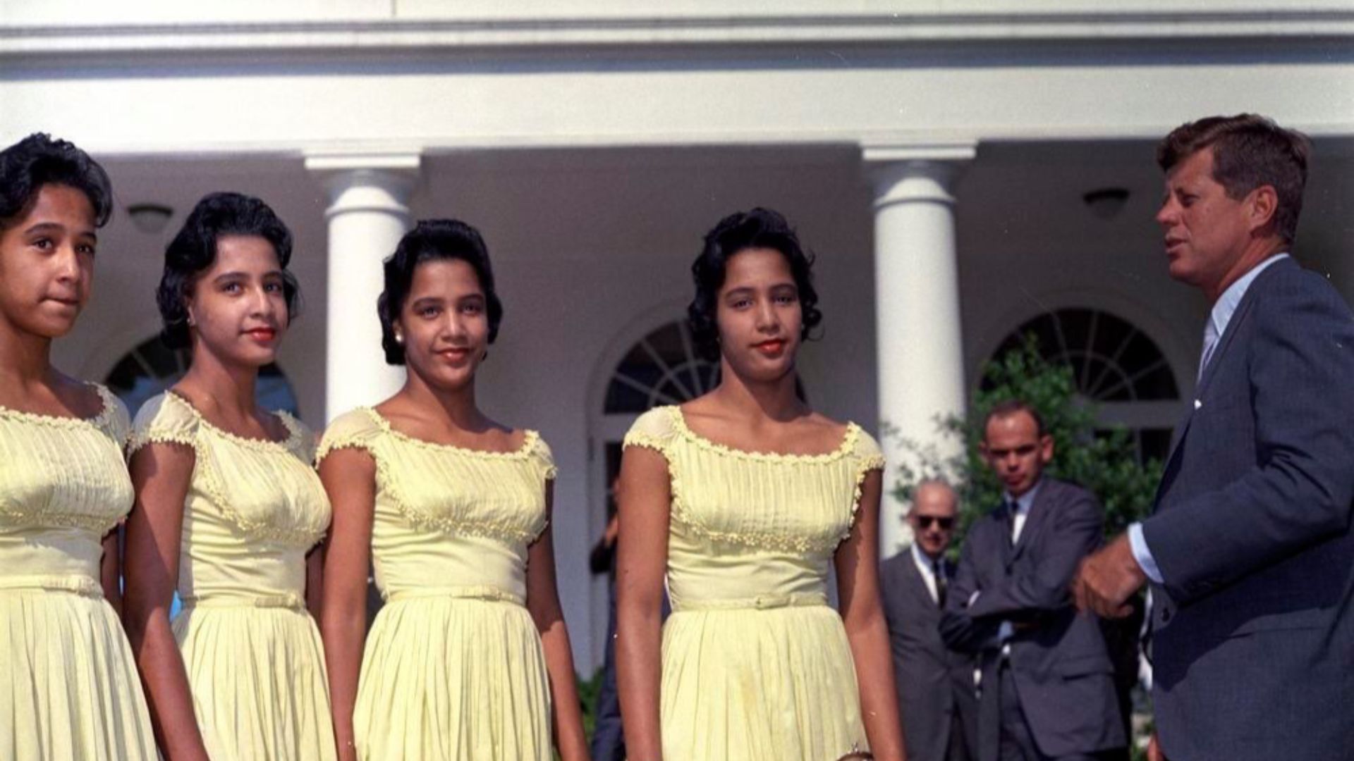 Fultz Quads meeting President JFK on Rose Garden in front of the White House. President John F. Kennedy visits with Mary Alice Fultz, Mary Louise Fultz, Mary Anne Fultz, and Mary Catherine Fultz, a set of quadruplets from Milton, North Carolina, 2 August