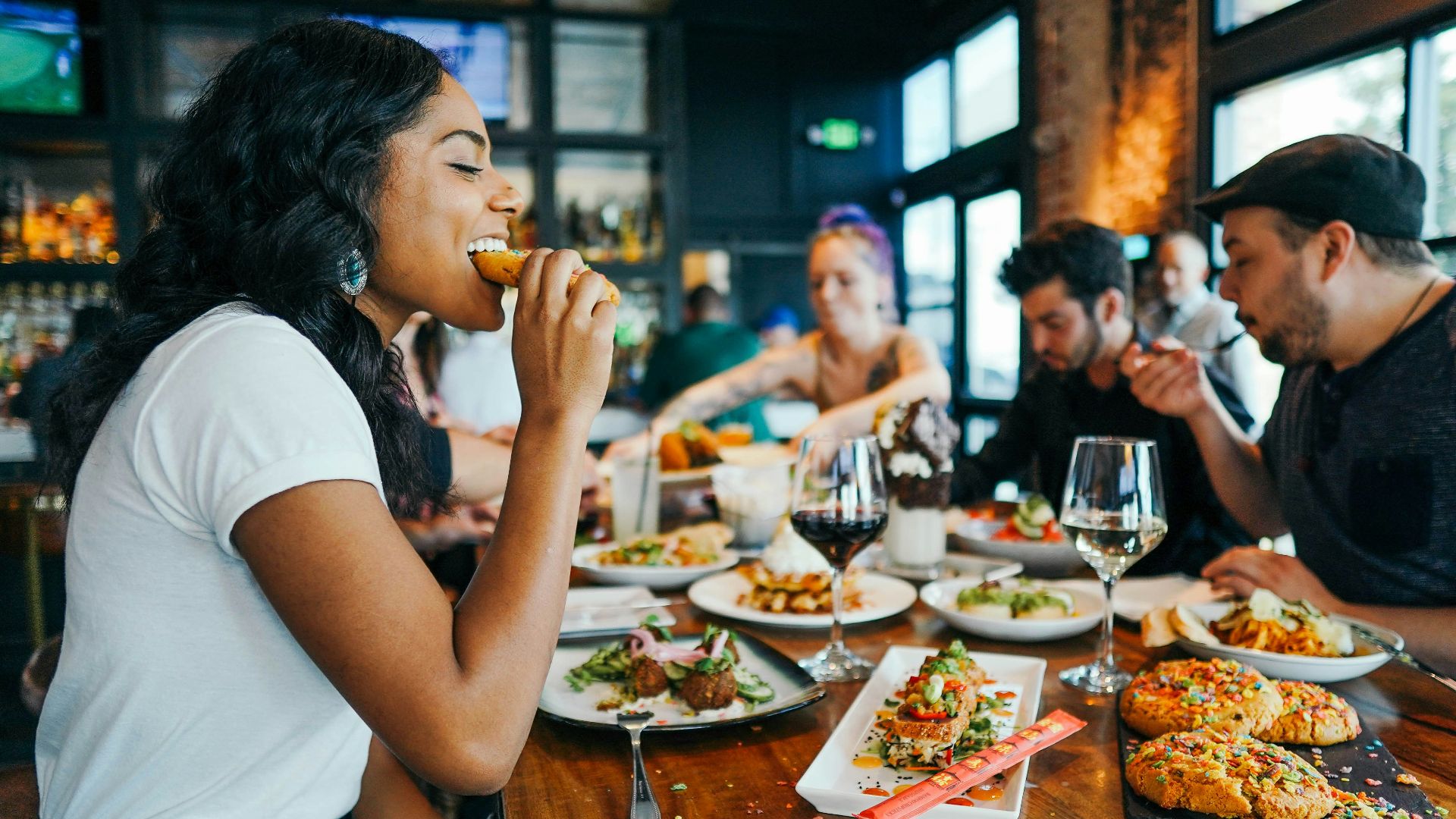 woman in white shirt eating