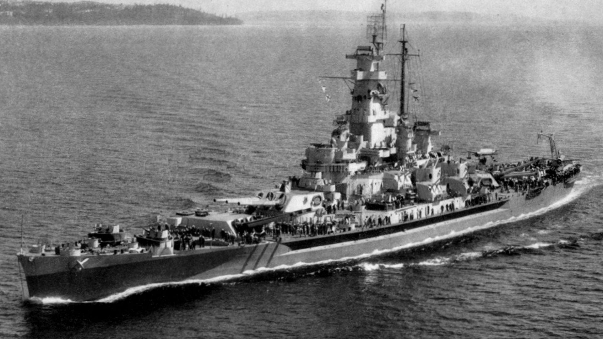 The U.S. Navy battleship USS Massachusetts (BB-59) underway, most probably after her refit at the Puget Sound Naval Shipyard, Washington (USA), circa in July 1944. She is painted in Camouflage Measure 22.