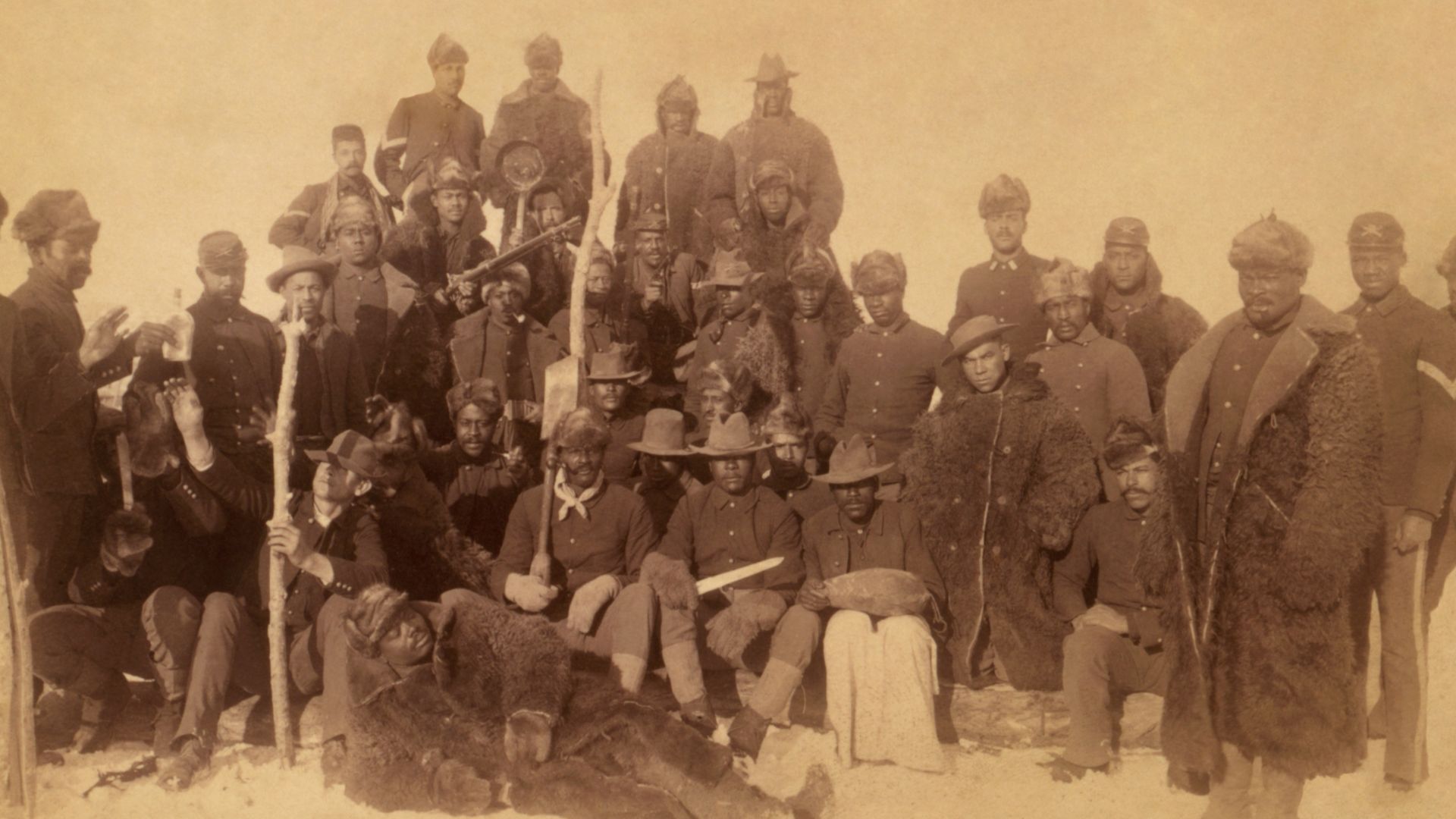 Buffalo soldiers of the 25th Infantry, some wearing buffalo robes, Ft. Keogh, Montana