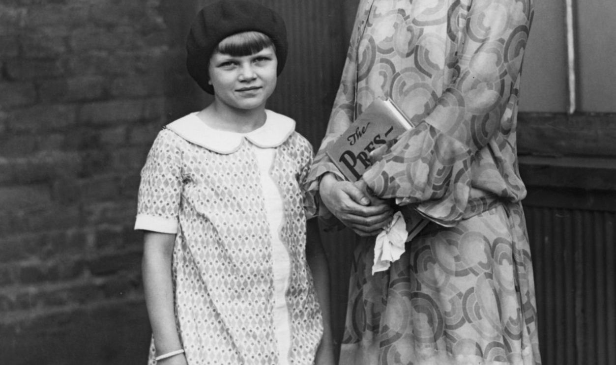 Portrait of American author Nan Britton (1896 - 1991) (right) and her daughter, Elizabeth Ann (later Blaesing, 1919 - 2005), New York, New York, 1927. Britton holds a copy of book, 'The President's Daughter,' which detailed her six-year affair with US President Warren G Harding (who had in 1924) which resulted in the conception of their illegitimate daughter. 