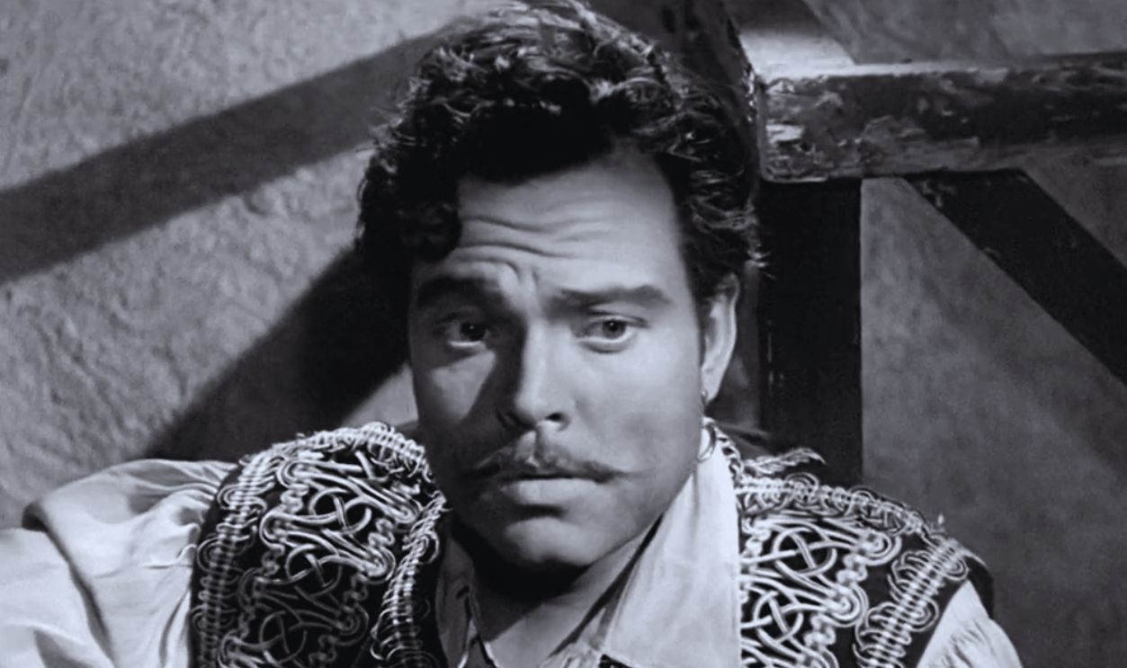Screenshot from Black Magic (1949)