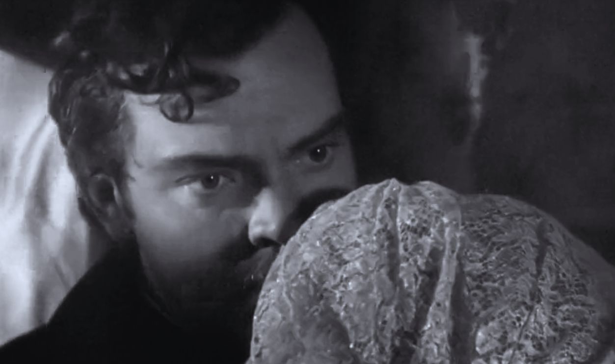 Screenshot from Black Magic (1949)
