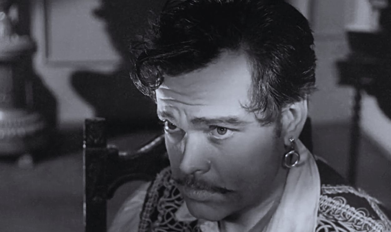 Screenshot from Black Magic (1949)