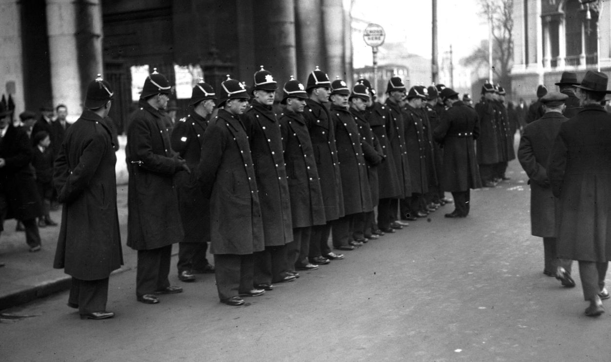 Officers of Dublin's Metropolitan Police line up to keep crowds in order during Cosgrave's election meeting at College Green in Dublin.