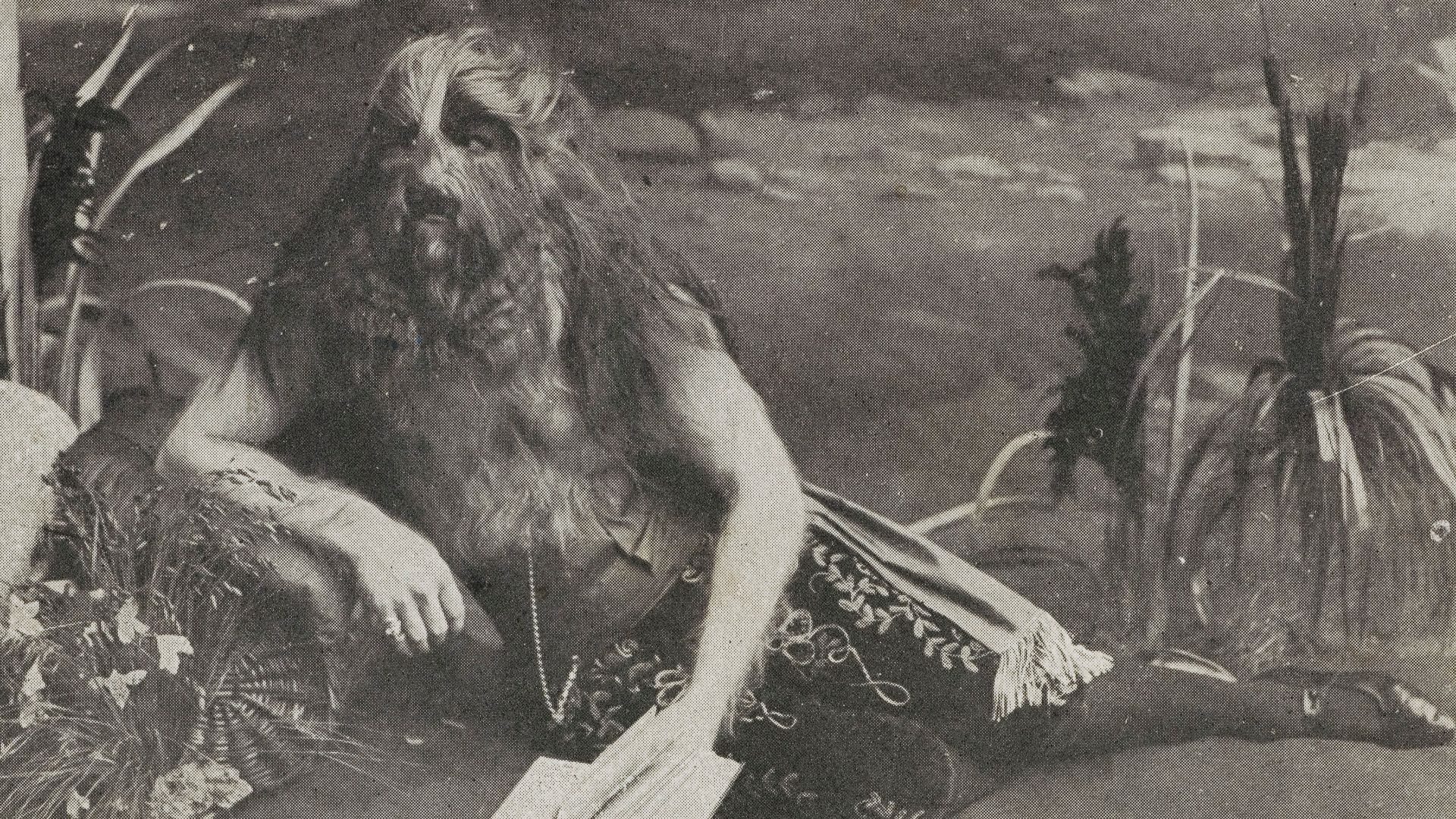 Postcard showing Lionel der Löwenmensch or Lionel the Lion Faced Boy as he was known in English. Born in Poland in 1890 as Stephan Bibrowsky, he suffered from Hypertrichosis. He is shown here in exotic costume, reading, reclining on the ground his right e
