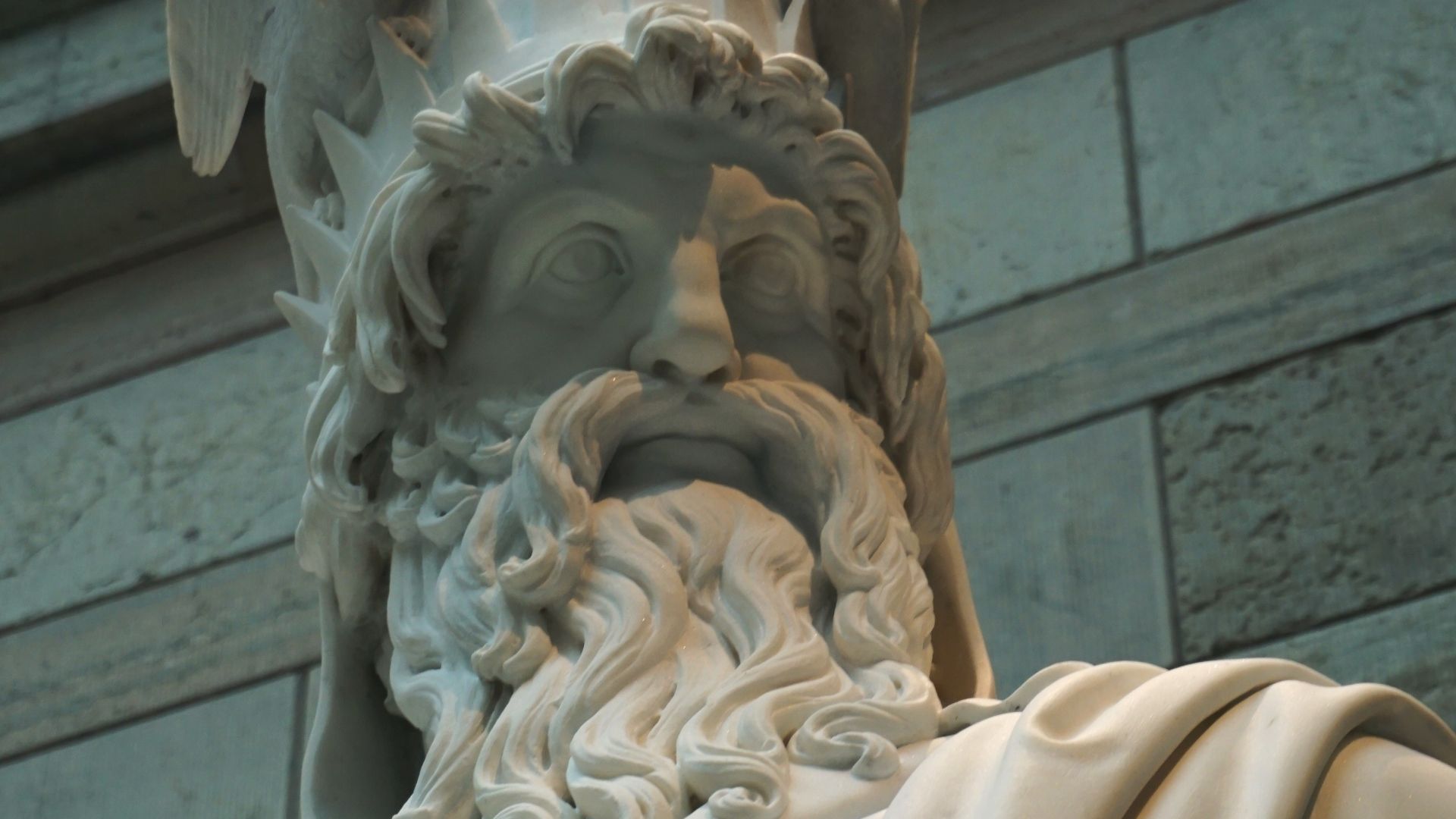 Photograph taken of the face and upper torso of the statue