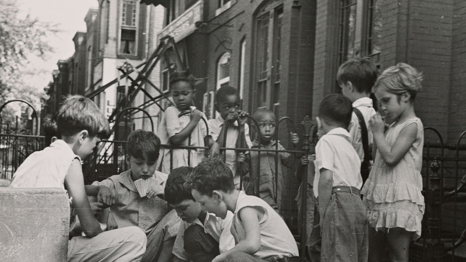 grayscale photography of children near outdoor