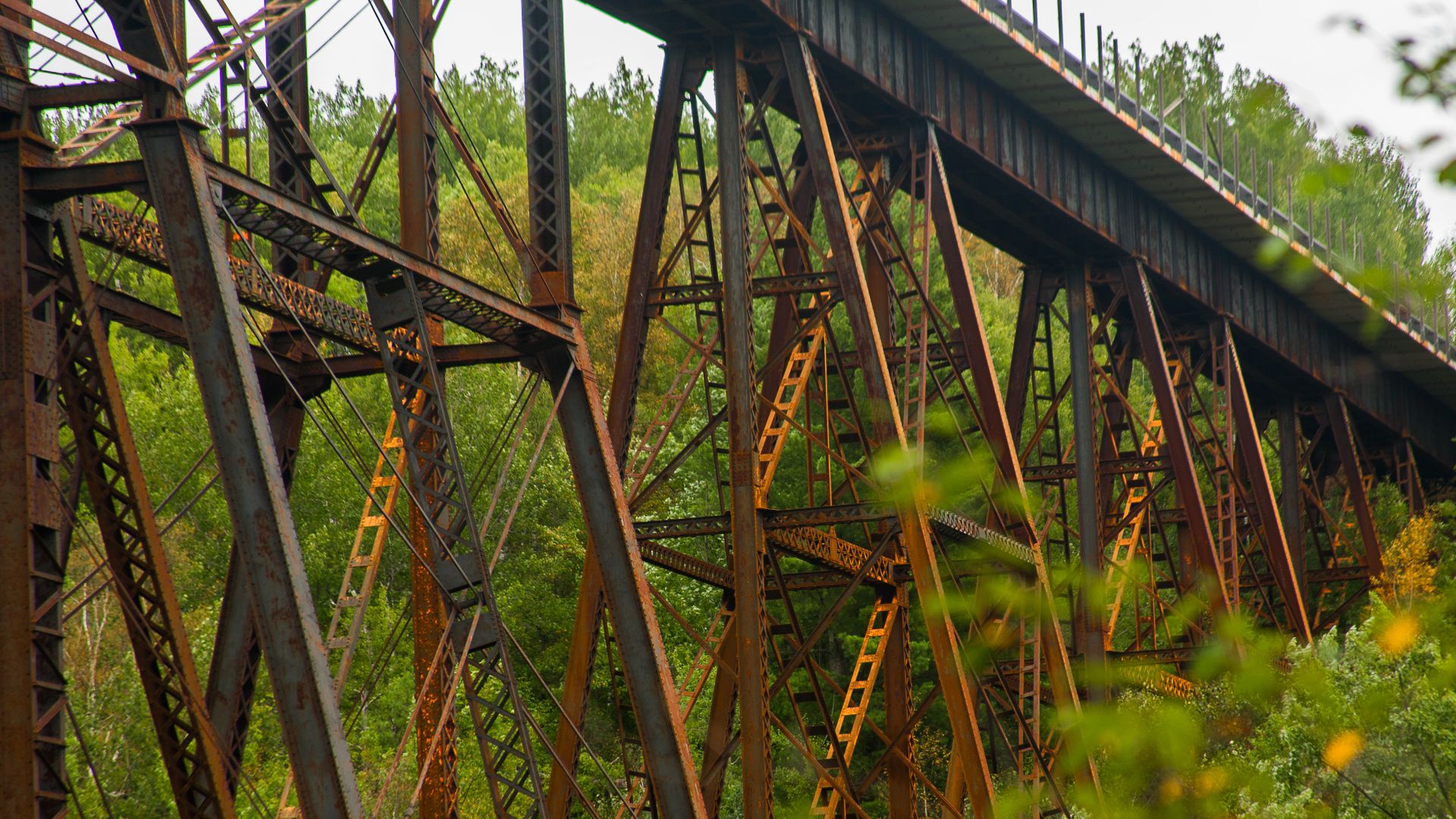 This railroad bridge carries the BNSF Hinckley Subdivision above the Kettle River in Sandstone, Minnesota. It replaced a previous wooden bridge that was destroyed in the great Hinckley Fire of 1894.