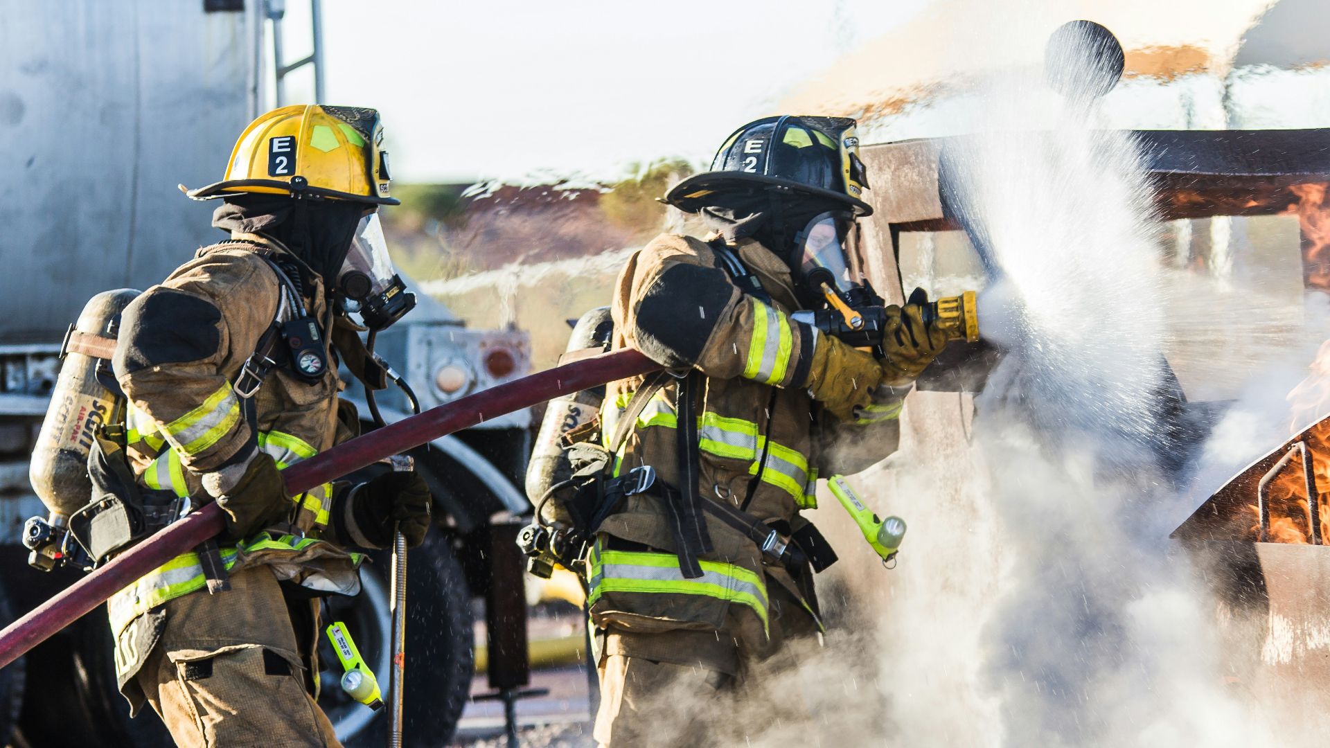 three fireman preventing fire during daytime