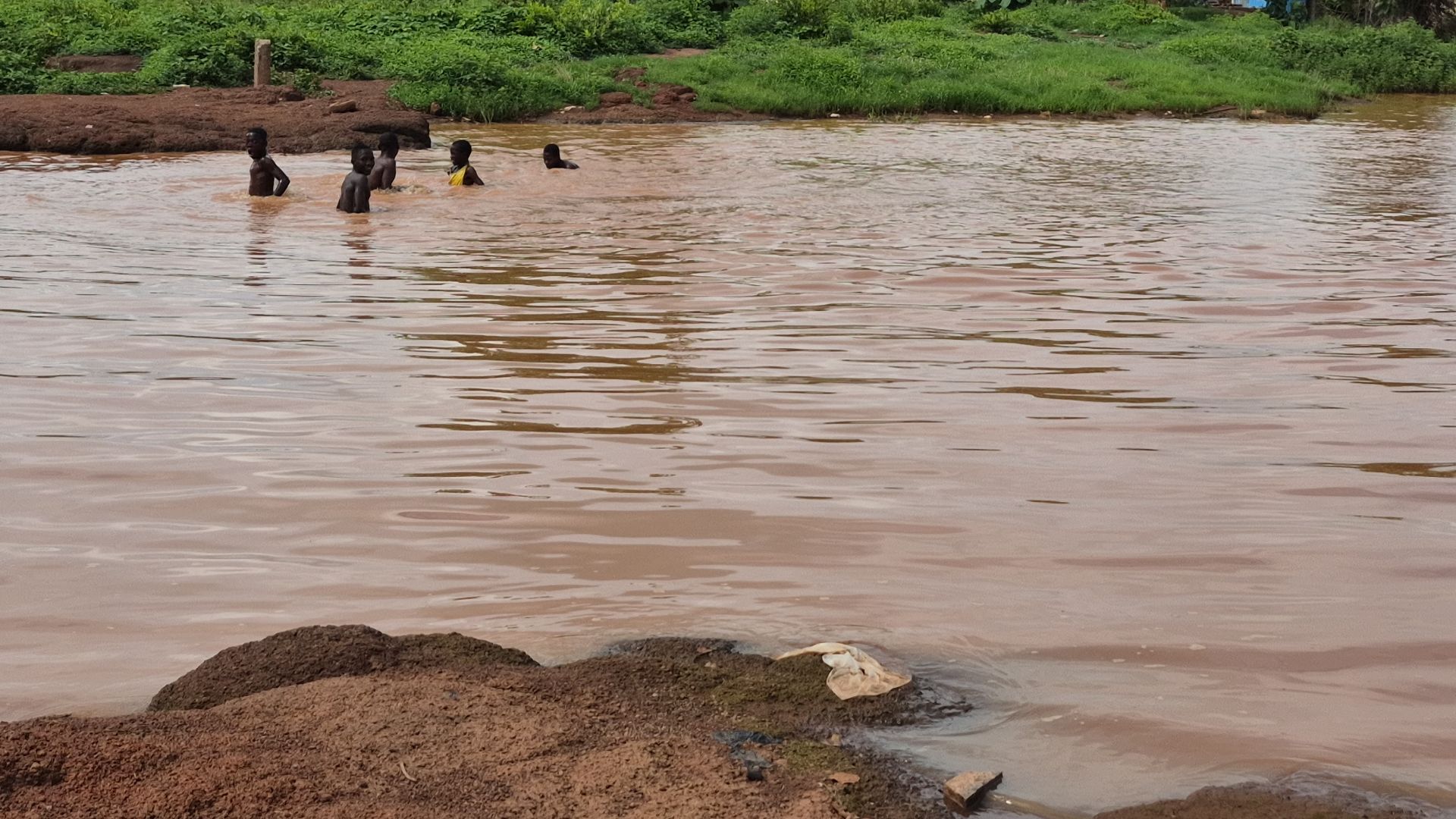 A muddy water body  found without a residential community