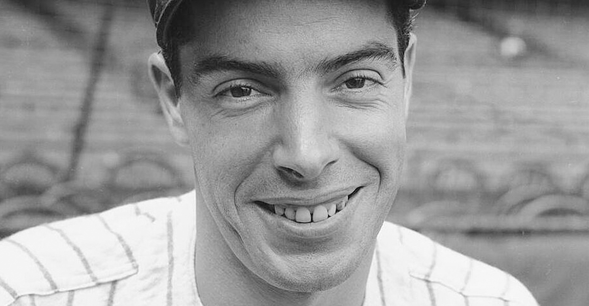 Joe DiMaggio posing in a Yankees jersey