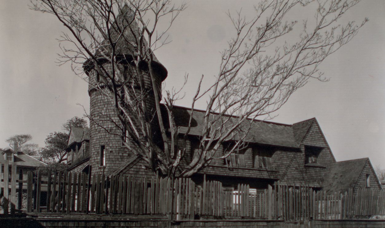 * Code: I.A.2.
Shingle style building with gables, a tower at one end, standing behind shingled wall with pickets on top
Citation/Reference: CNY# 175
