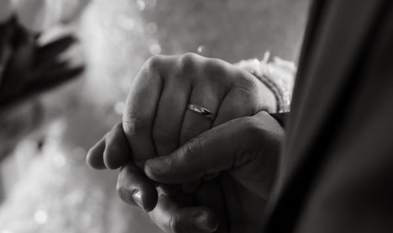 married couple holding hands