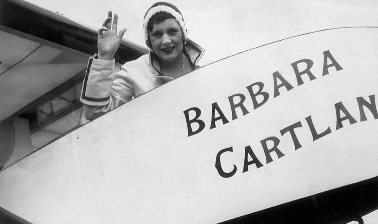 The romantic novelist Barbara Cartland (1901-) aboard the glider bearing her name, before its long distance test flight from Hanworth to Blackpool via Birmingham. This is the first time that a test has been made to prove the commercial value of an aeroplane over a tow glider, as advocated by Barbara Cartland. 