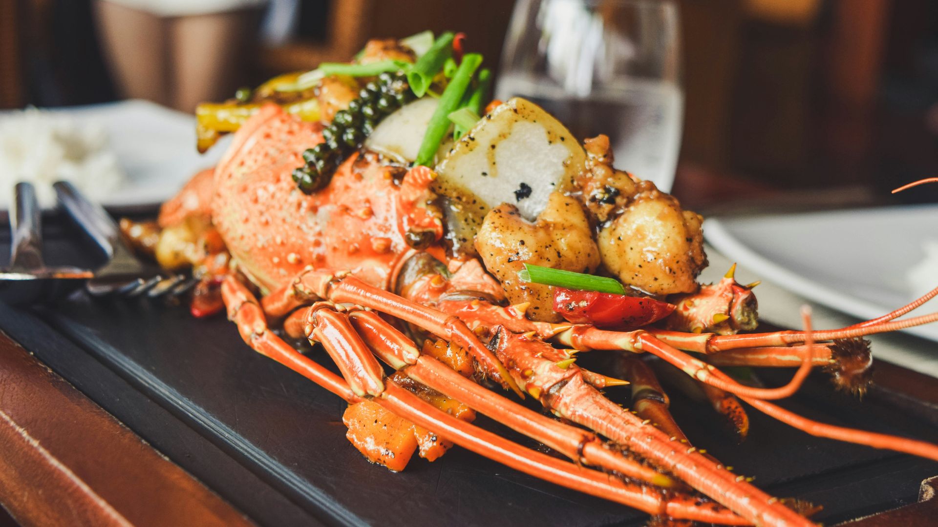 orange and white lobster on black tray