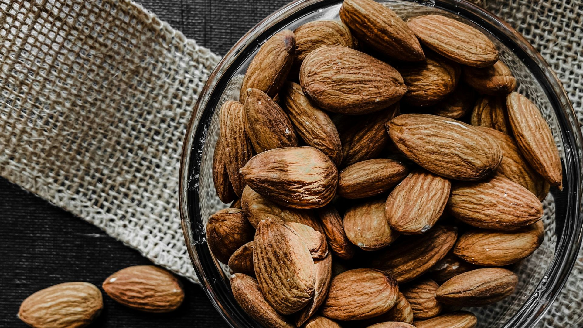 brown almond nuts on stainless steel bowl