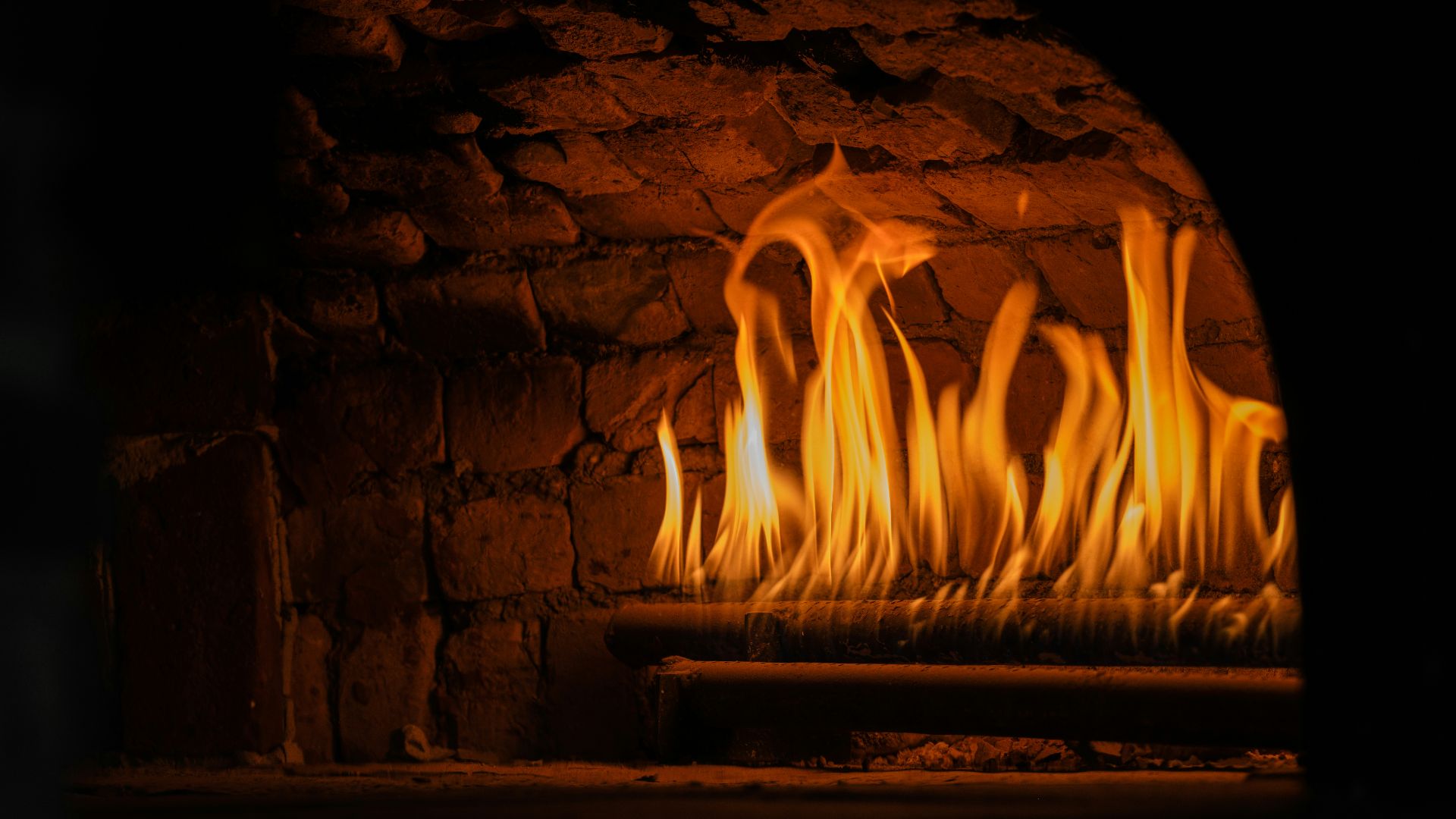a fire in a brick fireplace