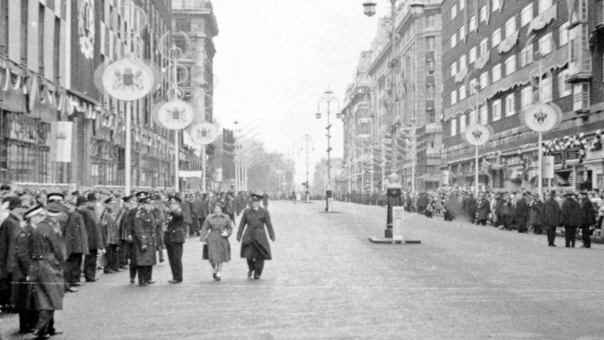 Coronation Day, 2 June 1953, waiting for the procession in Oxford Street