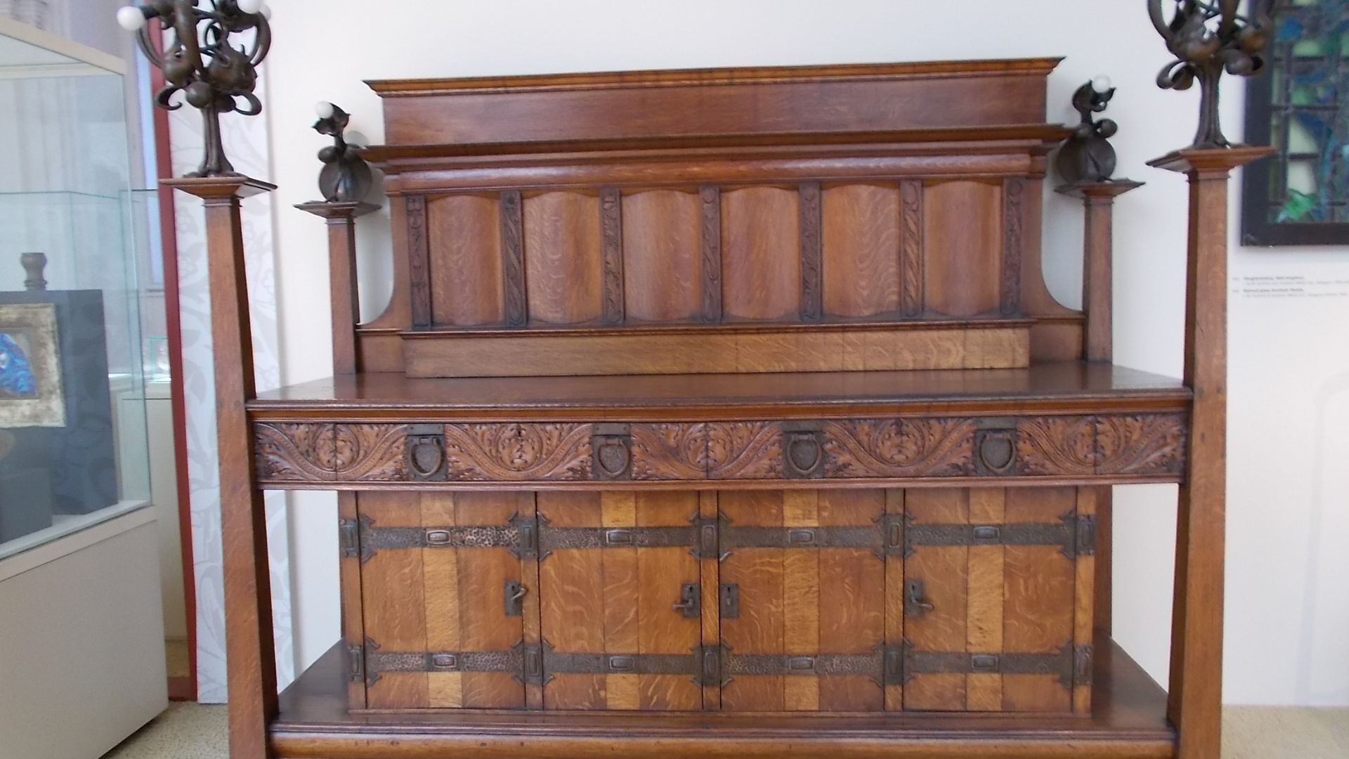 Carved oak Cupboard with copper mount by Bath Cabinet Makers Co., 1899. Budapest Museum of Applied Arts. - Üllői Avenue, Hőgyes Endre Street, Kinizsi Pál Street, Budapest District IX , Hungary