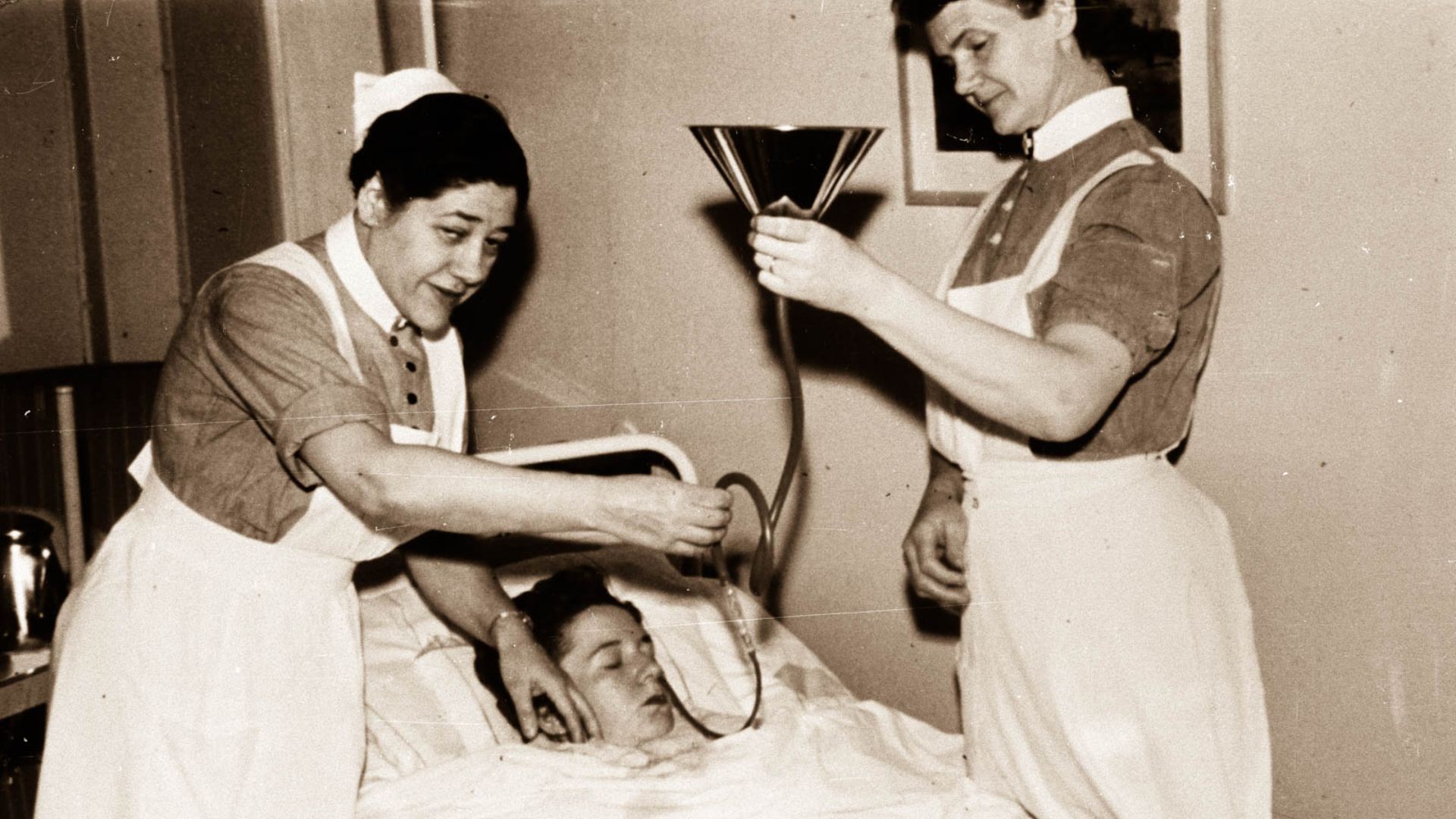 Insulin shock therapy performed by unnamed nurses on an unnamed patient. Source indicates that it was shot around the year 1930, however, as results of the procedure were first made public in 1933, and the practice wasn't widespread until a few years afte