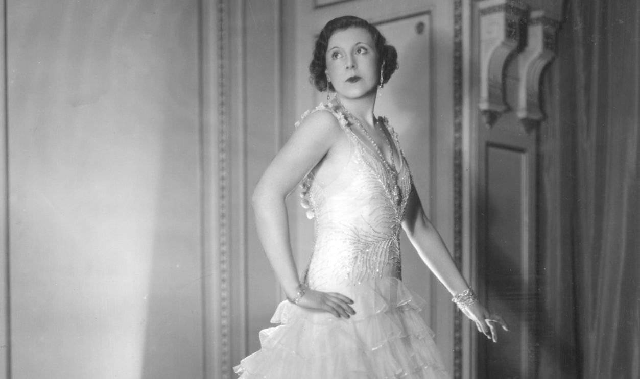 1930: Mrs A G McCorquodale, aka English romantic novelist Barbara Cartland (1901 - 2000), wearing an evening dress. 