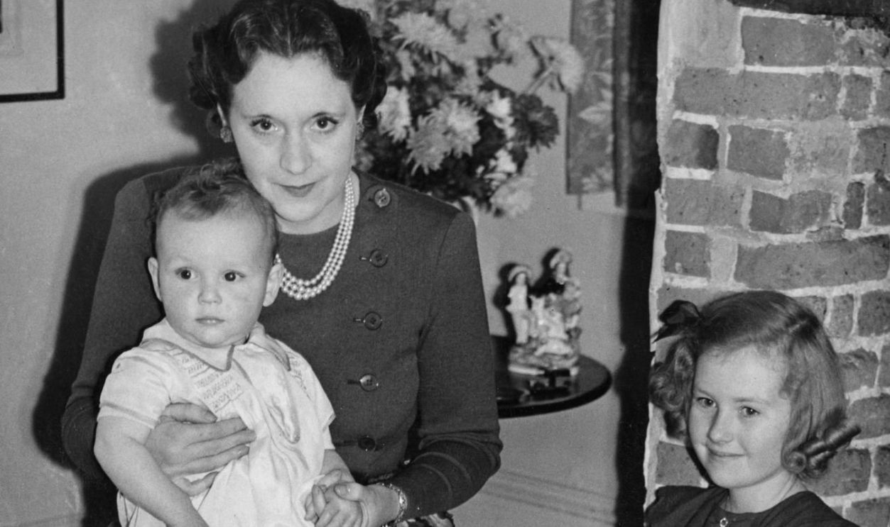 Novelist Barbara Cartland with her three children, Glen, Raine and Ian, 16th December 1940. They have returned from Canada and are living in Bedfordshire after their home in Grosvenor Square was bombed. 