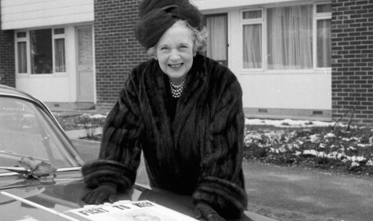 Author Barbara Cartland visiting people door-to-door as part of her election campaign, Hatfield New Town, Hertfordshire, March 16th 1964.