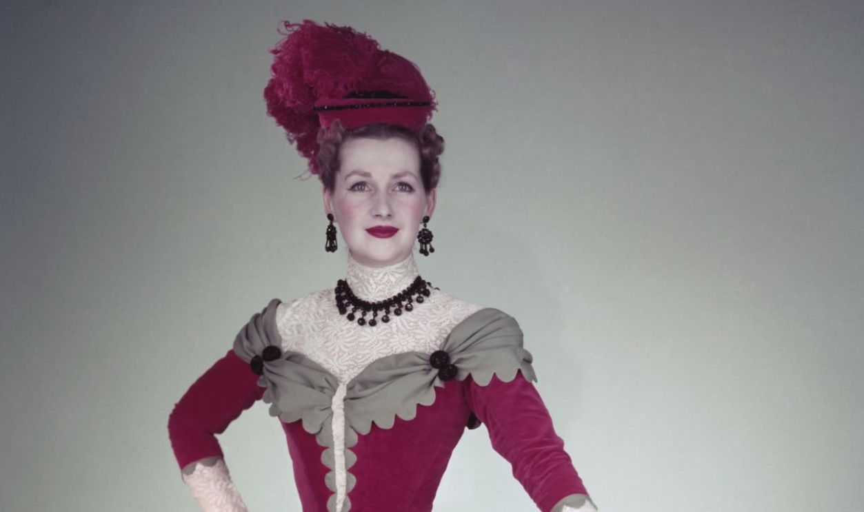 The Honourable Mrs Gerald Legge (1929 - 2016), later known as Comtesse de Chambrun, and Raine Spencer, Countess Spencer, wearing Edwardian period costume, London, 1953. She was the daughter of romantic novelist, Dame Barbara Cartland, and the step-mother of Diana, Princess of Wales.