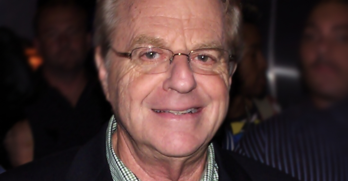 Jerry Springer wearing a checkered collar and glasses