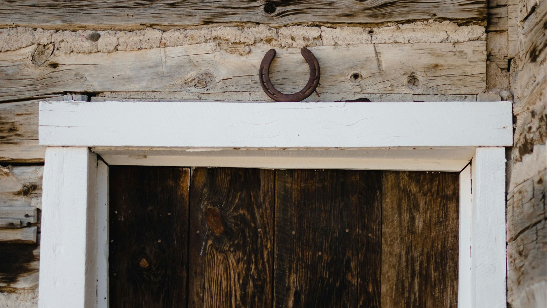 a wooden door with a sign on it