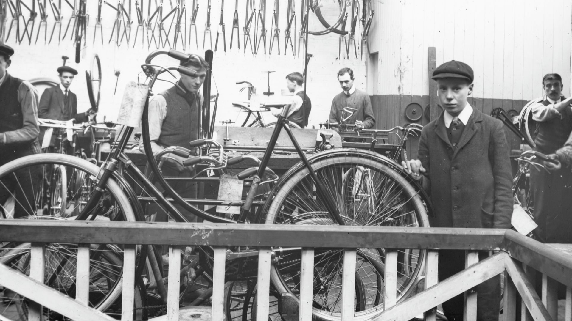 Hard at work assembling bicycles at a firm called O'Neill's. That young lad looks terrified. Do you know where this firm was? As usual, any and all information about this lantern slide will be entertained, brought out to dinner, and then put in a taxi hom