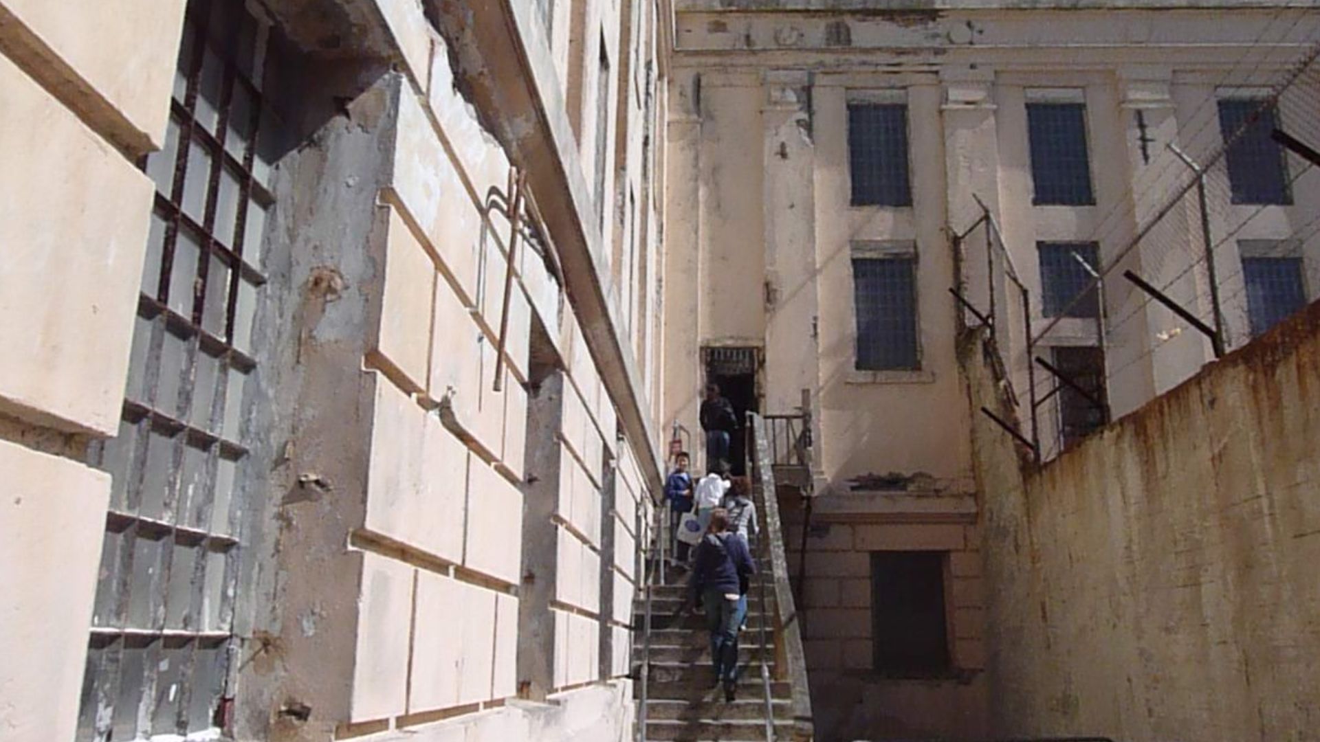 Exterior view of the main jailhouse from the exercise yard of Alcatraz in San Francisco, CA.