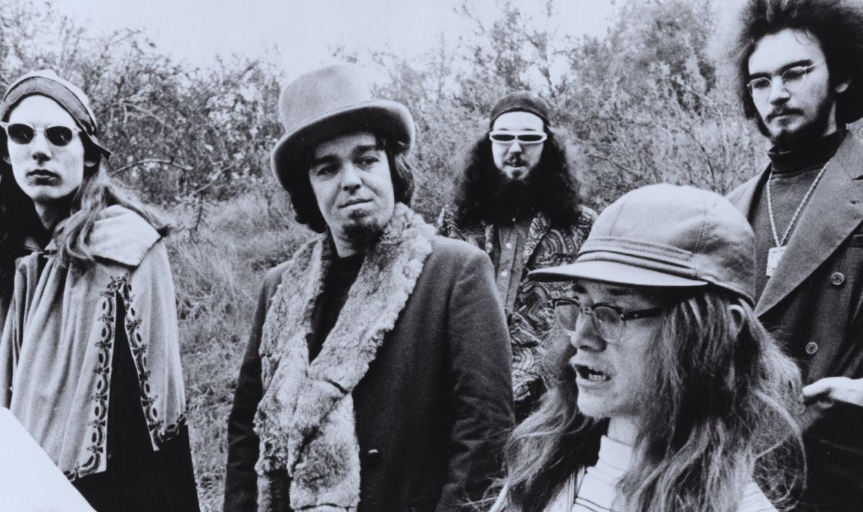 Bill Harkleroad aka Zoot Horn Rollo (guitar, left) and Captain Beefheart aka Don Van Vliet, with other members of Captain Beefheart and His Magic Band pose for a portrait during the time the album 'Trout Mask Replica' was being recorded, circa 1969. 