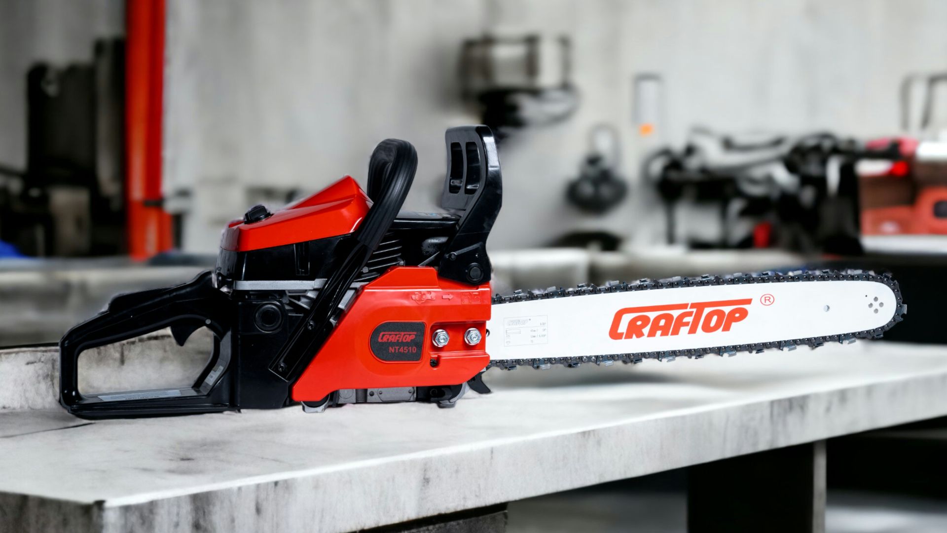 a red and black chainsaw sitting on top of a table