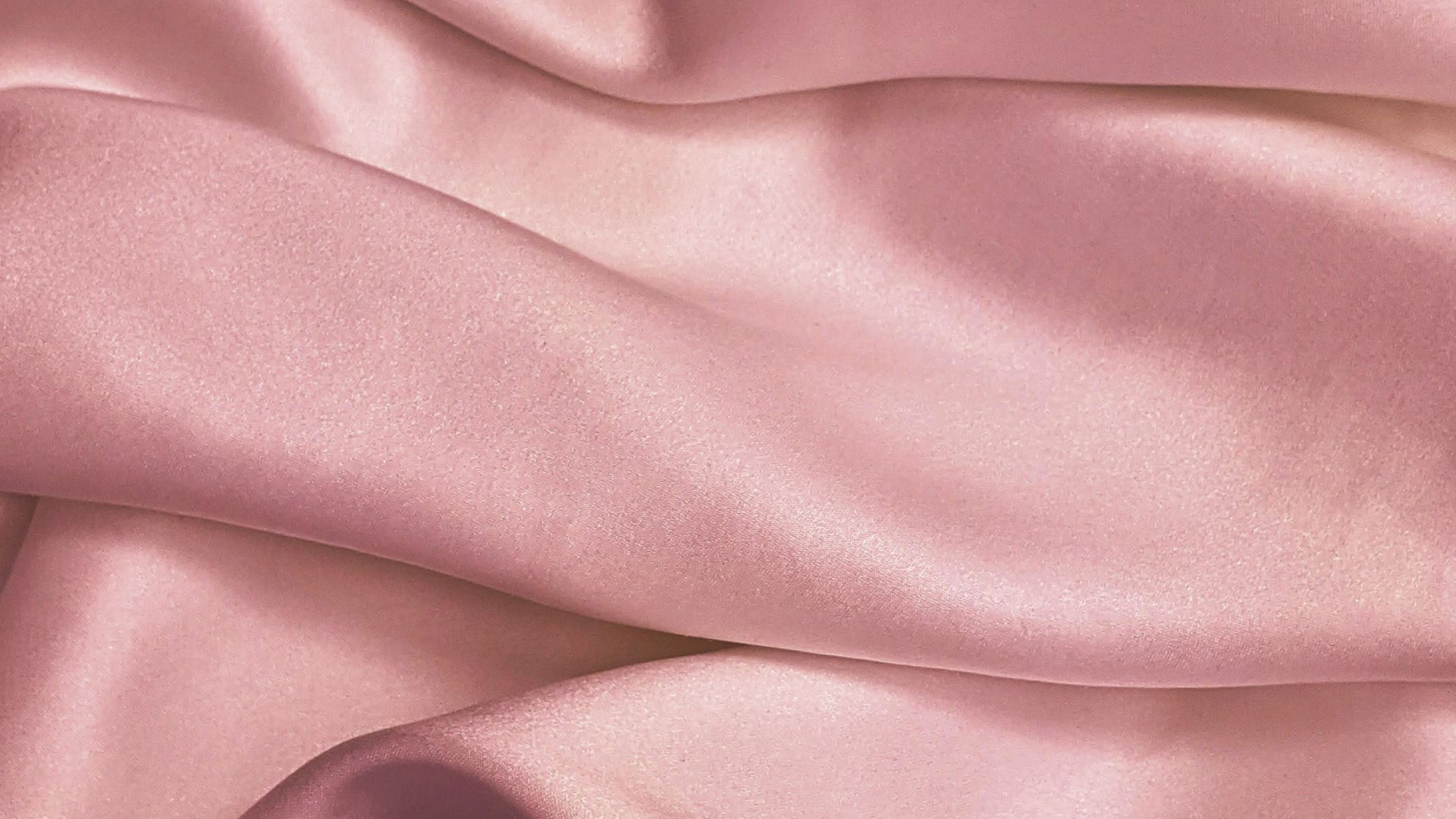 pink textile in close up photography